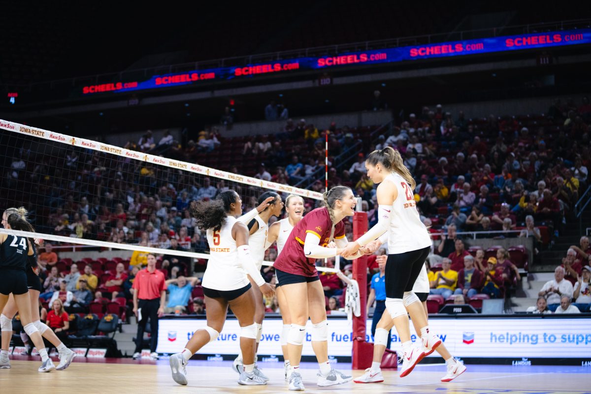 The Iowa State volleyball team celebrates during the Iowa State vs Cincinnati volleyball game at Hilton Coliseum on Oct. 2, 2024.