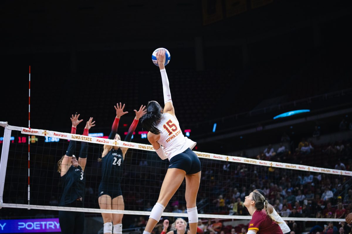 Kiersten Schmitt (15) hits the ball during the Iowa State vs Cincinnati volleyball game at Hilton Coliseum on Oct. 2, 2024.