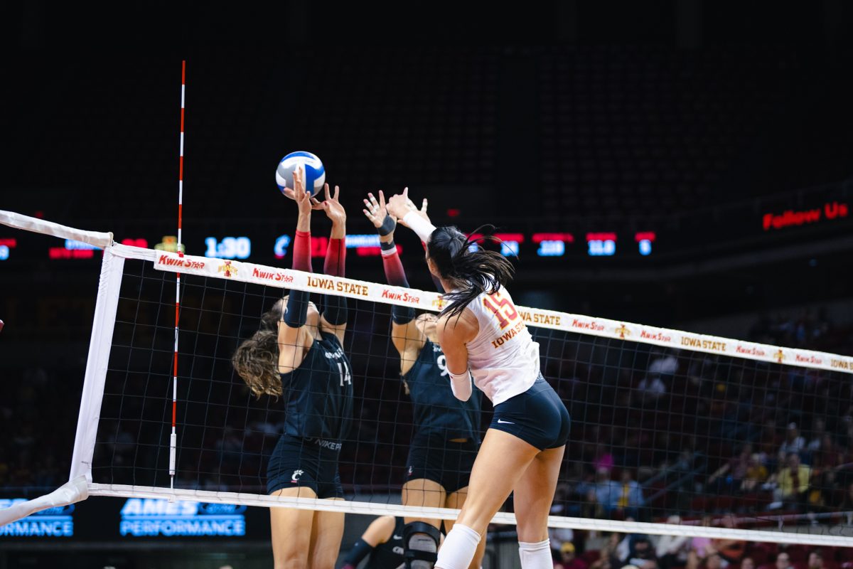 Kiersten Schmitt (15) hits the ball during the Iowa State vs Cincinnati volleyball game at Hilton Coliseum on Oct. 2, 2024.