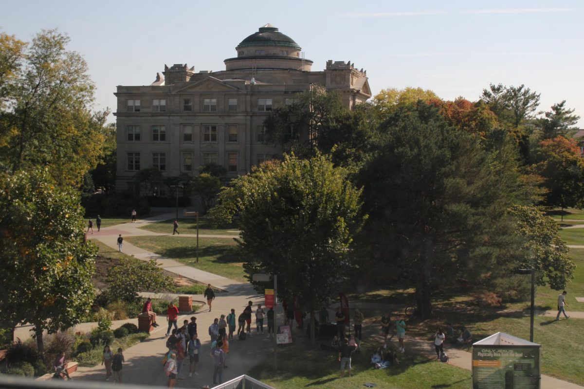 Throughout the day, students listen into Campus America and their message through preaching outside of the Parks Library, Oct. 9, 2024.