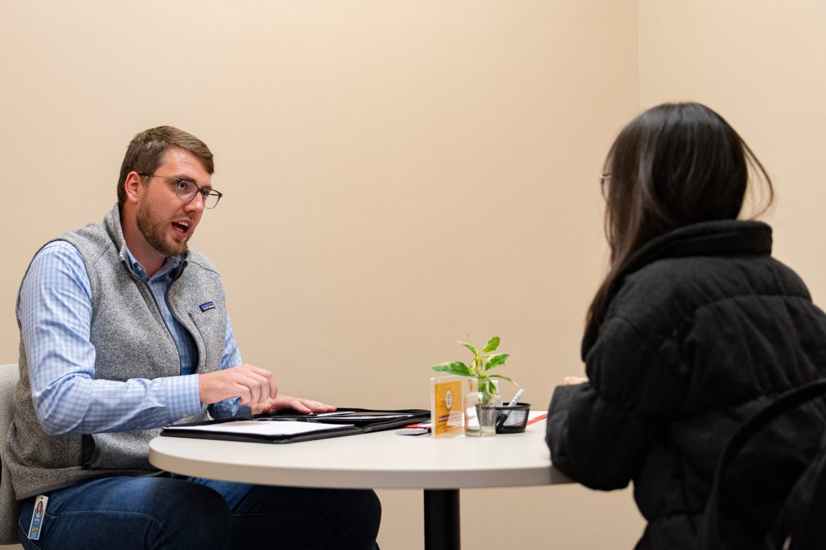 J.B.Hunt interviewer Samuel Miller talkes to Quyen Le about her resume during the Mocktails and Mock Interviews event in Gerdin, Oct. 2, 2024.