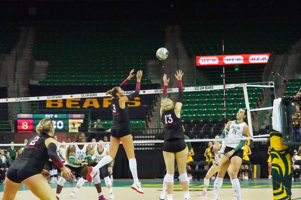 Iowa State volleyball's Tierney Jackson (3) and Lilly Wachholz (13) attempt to block a Baylor swing on Wed. Oct. 30. Photo by Caleb Garcia/The Baylor Lariat.