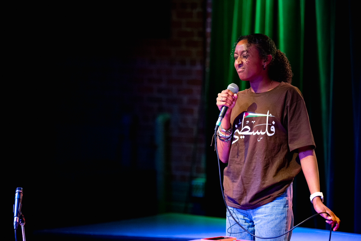 Iowa State freshman Munia Awadalla performs "If I Ain’t Got You" by Alicia Keys for open mic night in the Maintenance Shop located on the first floor of the Memorial Union on Oct. 15, 2024.