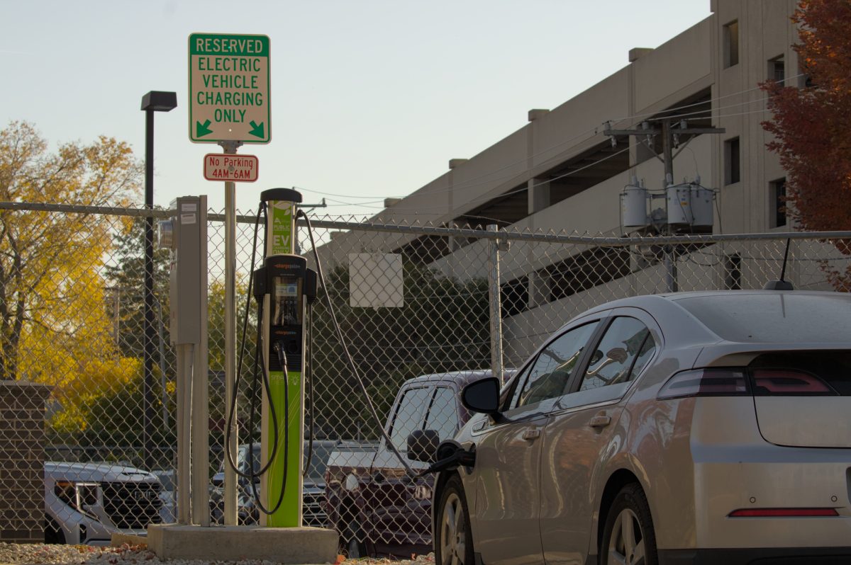 Electric vehicle charging at the Charge Point Ames Public Charging Station on Chamberlain St., Ames, Oct. 20, 2024.