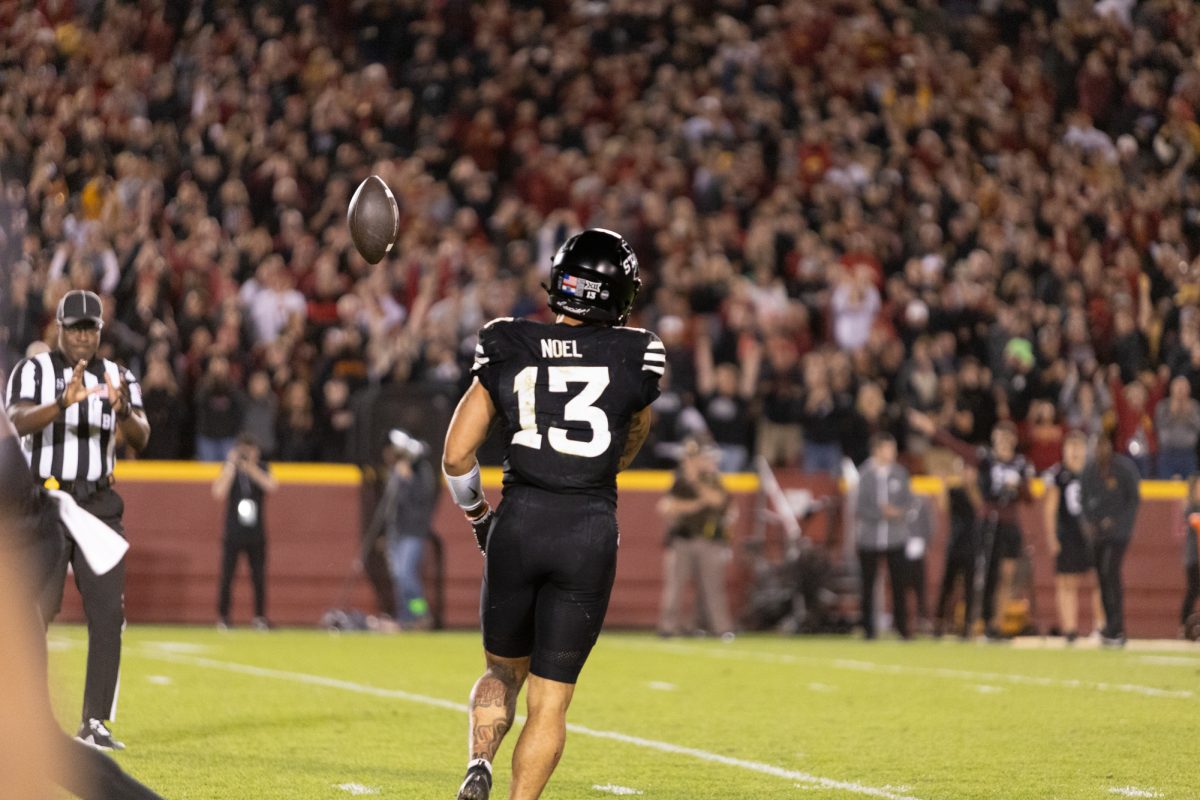 Jaylin Noel (13) Passes the ball back to the ref after successfully making the catch early in the 4th quarter at Jack Trice Stadium, Ames, Iowa, Oct. 19, 2024.