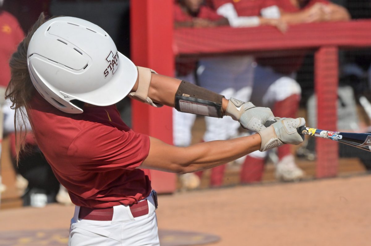 Iowa State Softball player Jessie Clemons (12) takes a swing at a pitch from the Kirkwood pitcher during a home game at the Cyclone Sports Complex, Oct. 2, 2024.