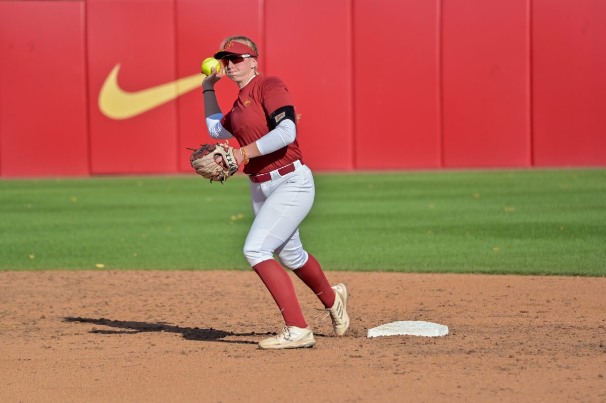 Iowa State Softball player Isabelle Nosan (8) turns to throw the ball to first for an out against Kirkwood at the Cyclone Sports Complex, Oct. 2, 2024.