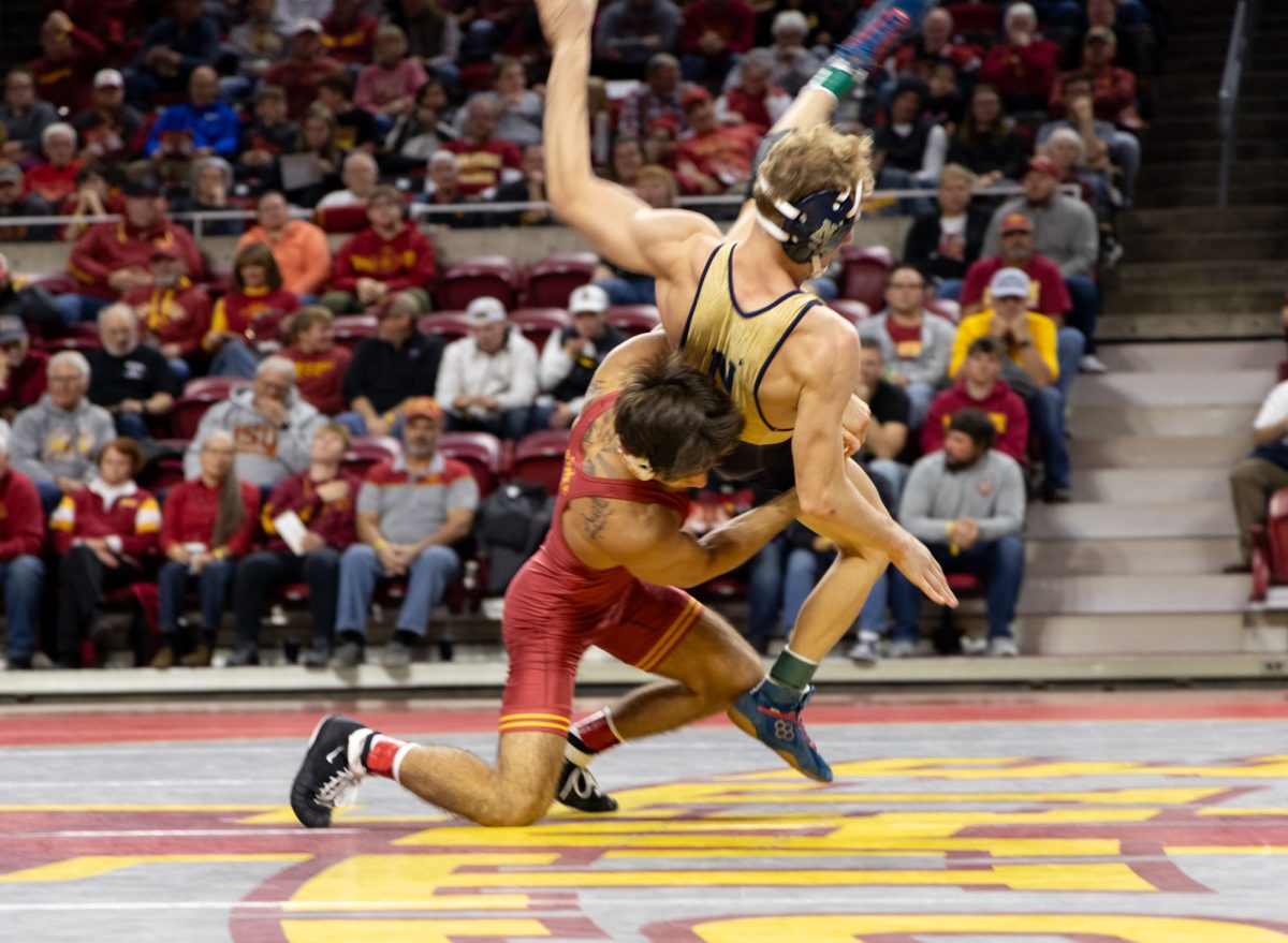 Adrian Meza takes down his opponent at the Iowa State vs. Navy wrestling meet, Hilton Coliseum, Ames, Iowa, Nov. 15, 2024.