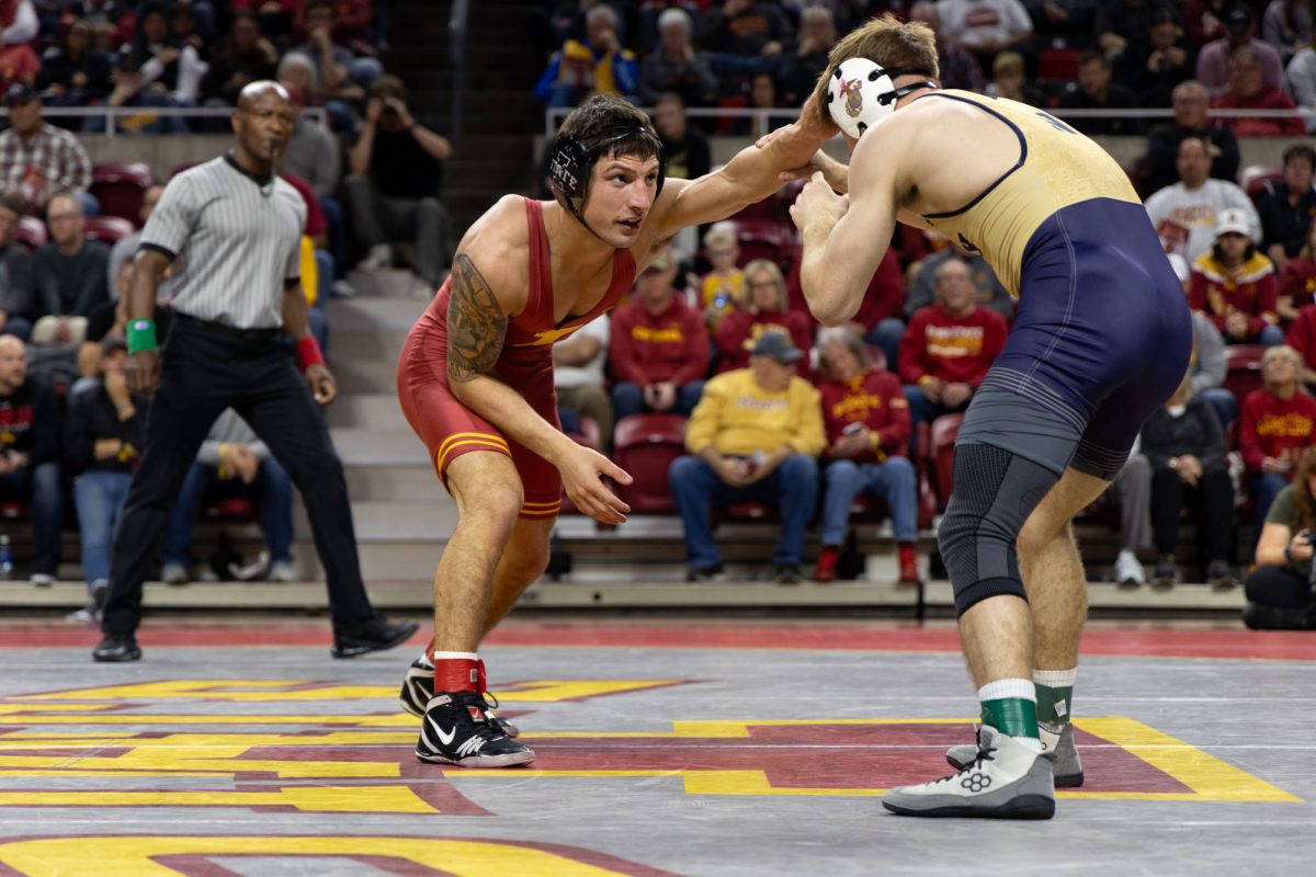 Zach Redding gauges his distance from his opponent at the Iowa State vs. Navy wrestling meet, Hilton Coliseum, Ames, Iowa, Nov. 15, 2024.