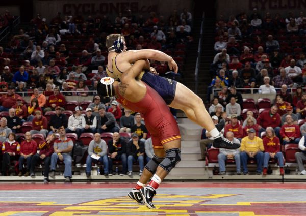 Daniel Herrera throws his opponent down at the Iowa State vs. Navy wrestling meet, Hilton Coliseum, Ames, Iowa, Nov. 15, 2024.