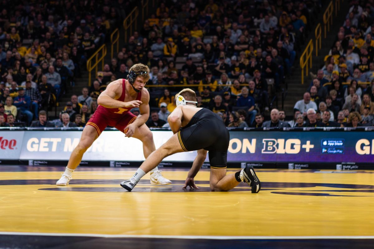 #15 Evan Bockman wrestles Angelo Ferrari at 184 pounds during the Iowa State vs. University of Iowa wrestling match at Carver-Hawkeye Arena on Nov. 23, 2024 in Iowa City, Iowa.