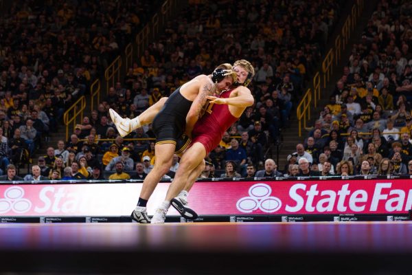 #15 Evan Bockman wrestles Angelo Ferrari at 184 pounds during the Iowa State vs. University of Iowa wrestling match at Carver-Hawkeye Arena on Nov. 23, 2024 in Iowa City, Iowa.