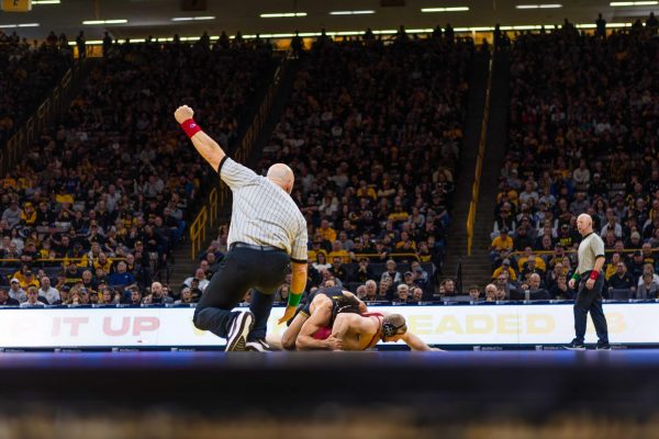 #20 Christian Carroll wrestles #2 Stephen Buchanan at 197 pounds during the Iowa State vs. University of Iowa wrestling match at Carver-Hawkeye Arena on Nov. 23, 2024 in Iowa City, Iowa.