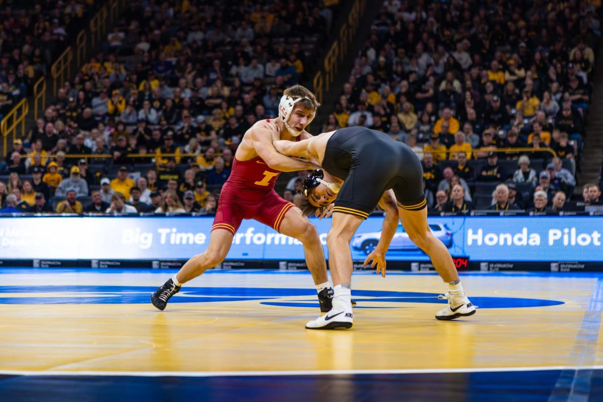 #5 Evan Frost wrestles #9 Drake Ayala at 133 pounds during the Iowa State vs. University of Iowa wrestling match at Carver-Hawkeye Arena on Nov. 23, 2024 in Iowa City, Iowa.