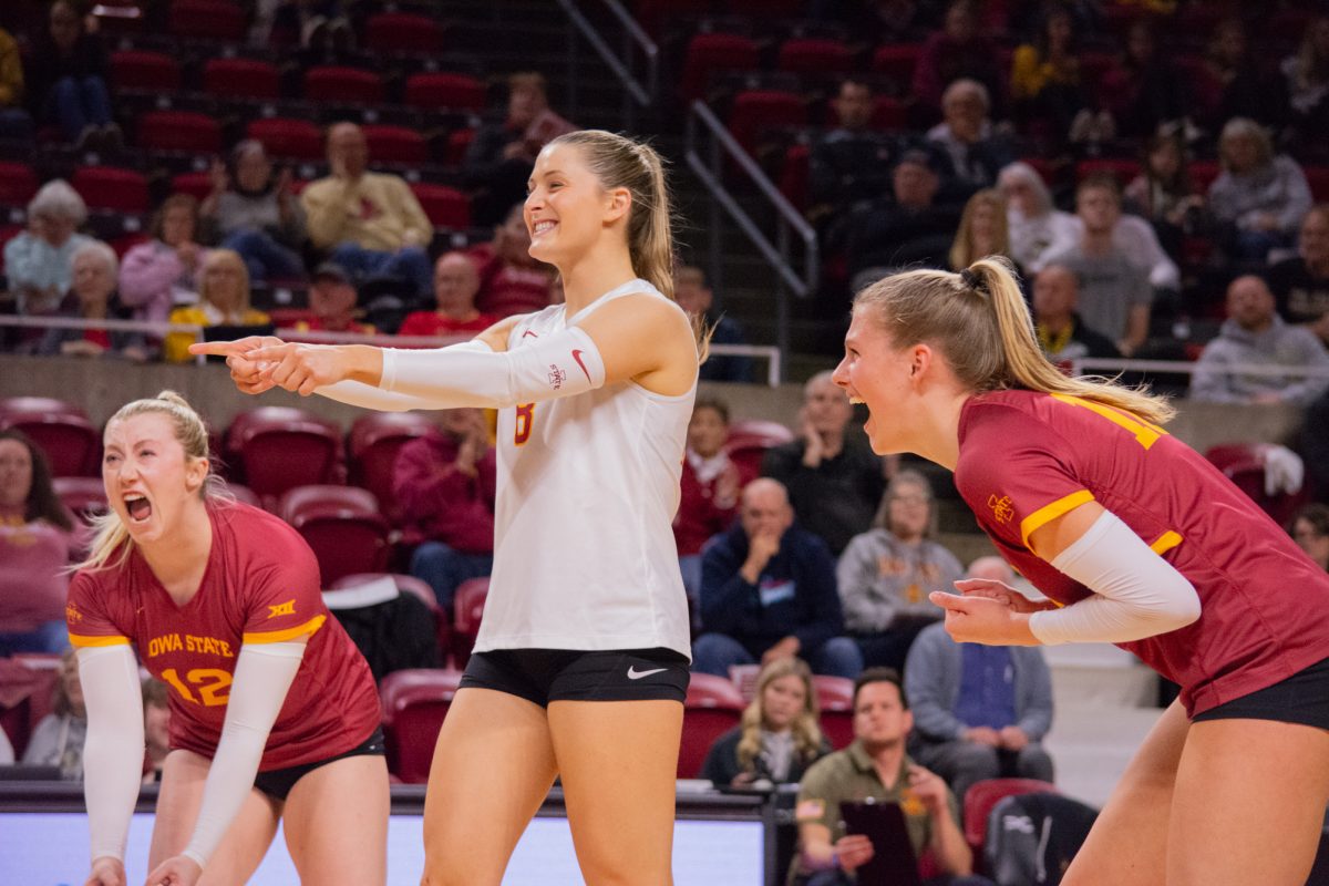 Emily Bobbitt (12), Brooke Stonestreet (8), and Rachel Van Gorp (10) celebrate scoring a point during the game vs. University of Colorado, Hilton Coliseum, Ames, Iowa, Nov. 13, 2024.