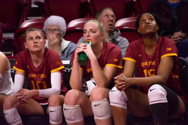 Rachel Van Gorp (10), Lilly Wacholz (13), and Amiree Hendricks-Walker (18) watch from the sideline during the game vs. University of Colorado, Hilton Coliseum, Ames, Iowa, Nov. 13, 2024.