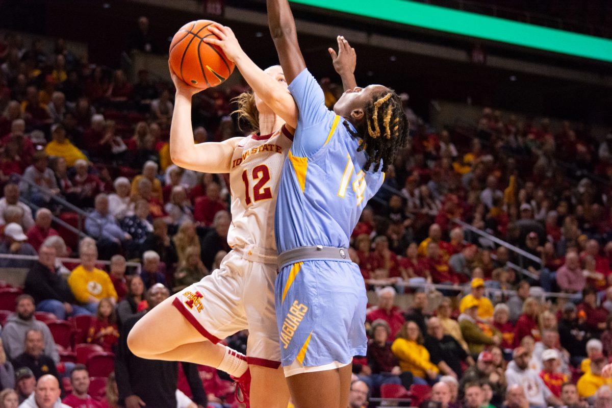 Kenzie Hare (12) does a layup while being guarded by Soniyah Reed (14) during the game vs. Southern University, Hilton Coliseum, Ames, Iowa, Nov. 10, 2024.