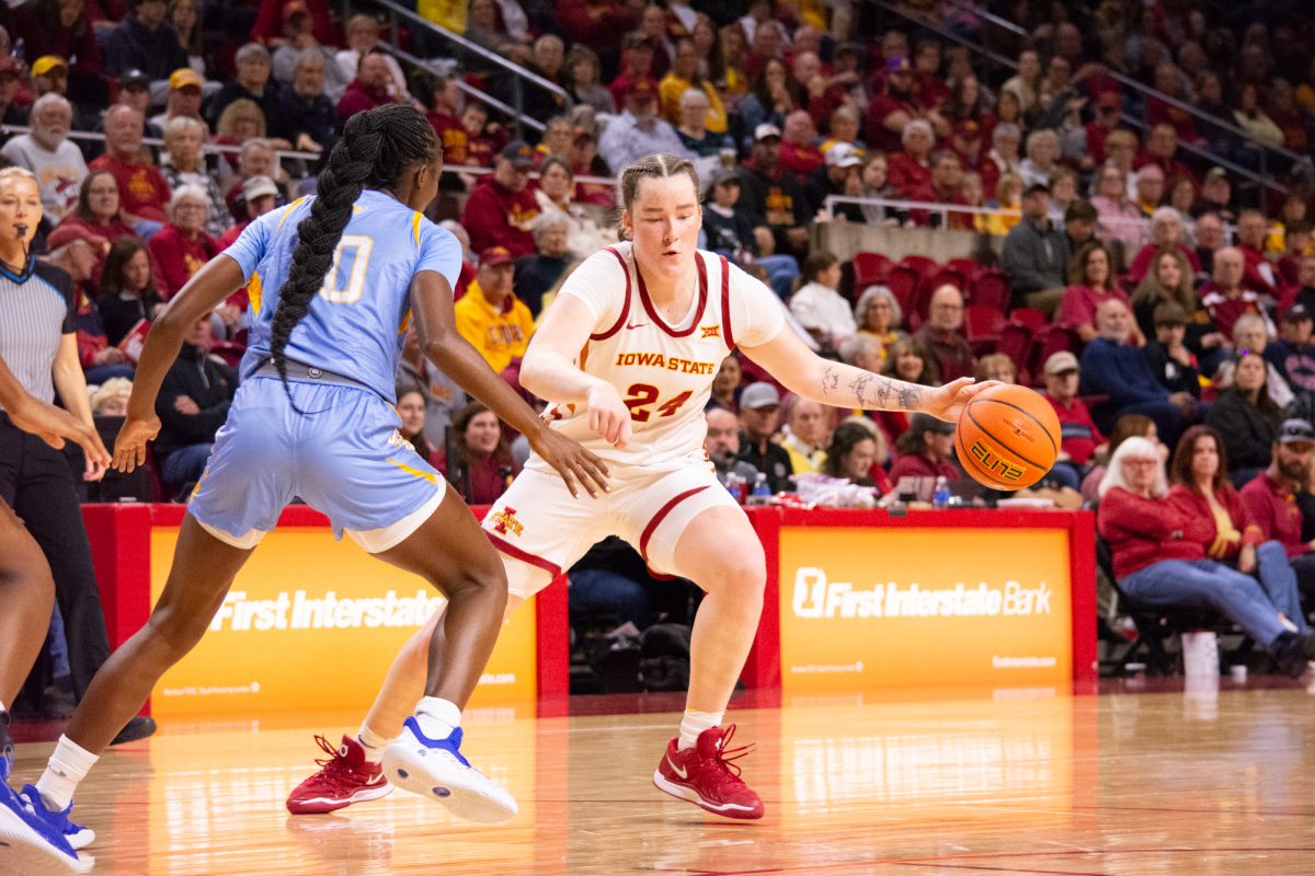 Addy Brown (24) dribbles the ball around Southern University defender Jocelyn Tate (10) during the game vs. Southern University, Hilton Coliseum, Ames, Iowa, Nov. 10, 2024.