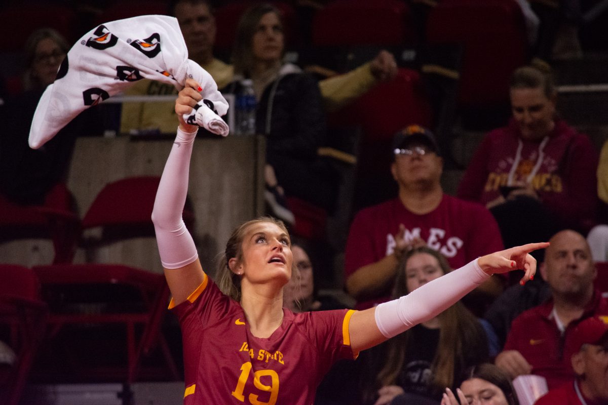 Faith DeRonde (19) waves a towel in the air after Iowa State scores during the game vs. University of Colorado, Hilton Coliseum, Ames, Iowa, Nov. 13, 2024.