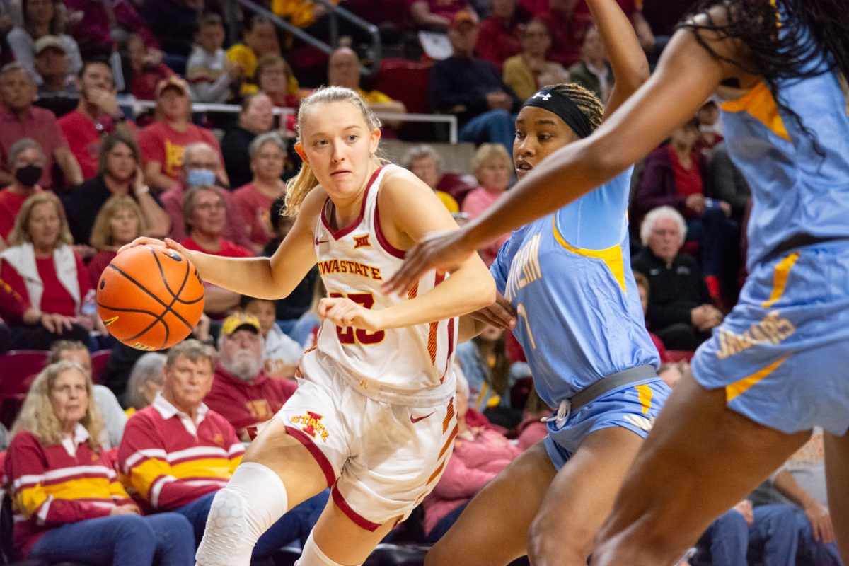 Kelsey Joens (23) dribbles the ball around a Southern University defender during the game vs. Southern University, Hilton Coliseum, Ames, Iowa, Nov. 10, 2024.