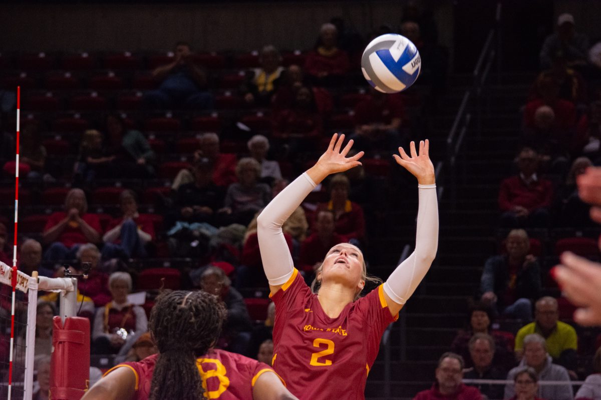 Morgan Brandt (2) sets the ball during the game vs. University of Colorado, Hilton Coliseum, Ames, Iowa, Nov. 13, 2024.