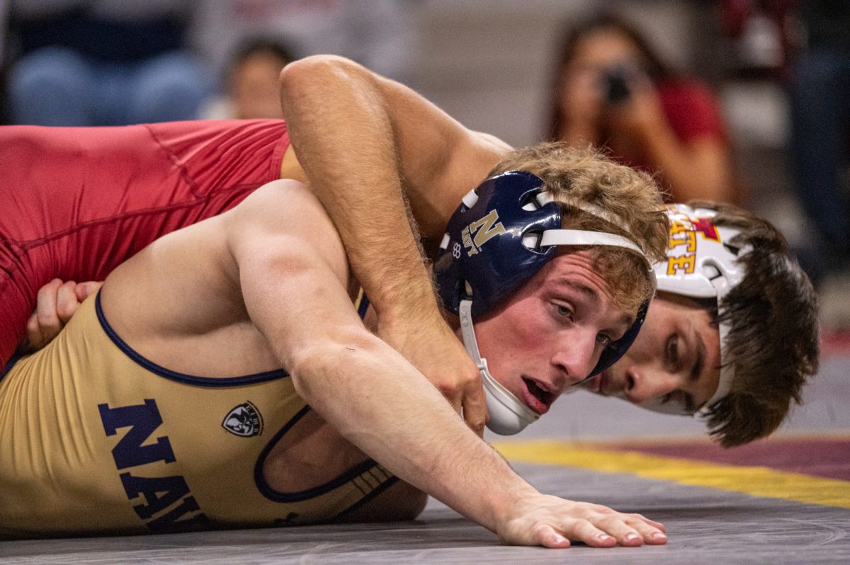 Iowa State Adrian Meza starts off the home match against Navy wrestlers winning his match in the 125 lb. weight class, starting the Cyclones off with their first four points of the match from a major decision, Hilton Coliseum, Nov. 15, 2024.