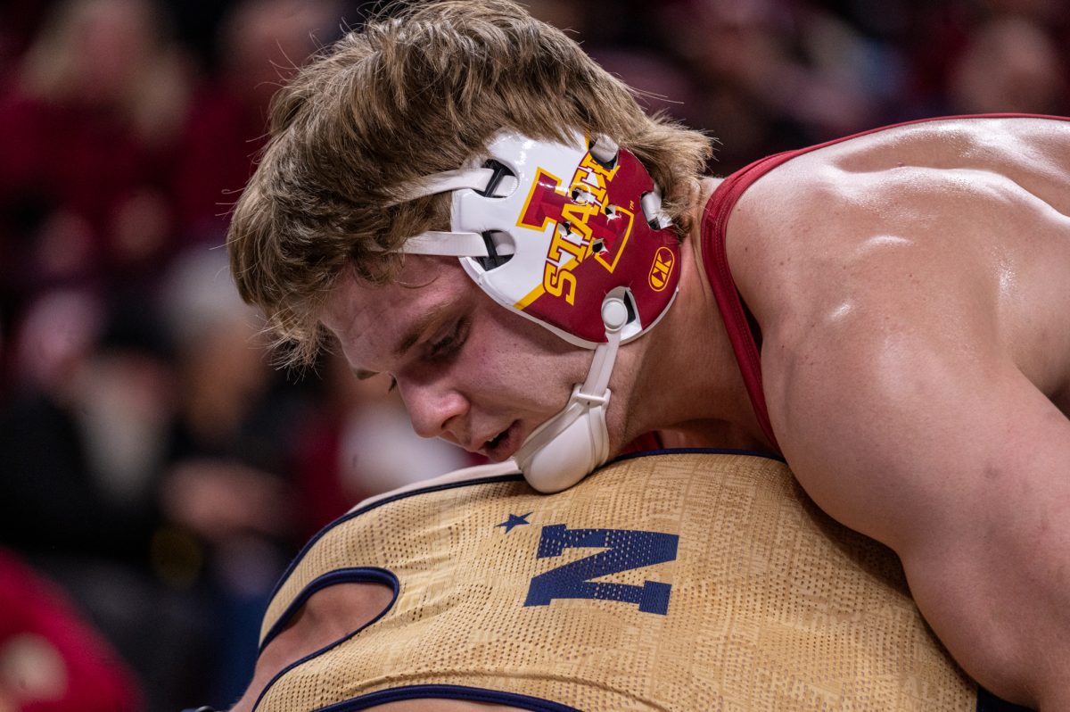 Iowa State Conner Euton wrestles the visiting Navy 165 weight class wrestler, winning by a tech fall gaining five points for Iowa States team score, at Hilton Coliseum, Nov. 15, 2024.