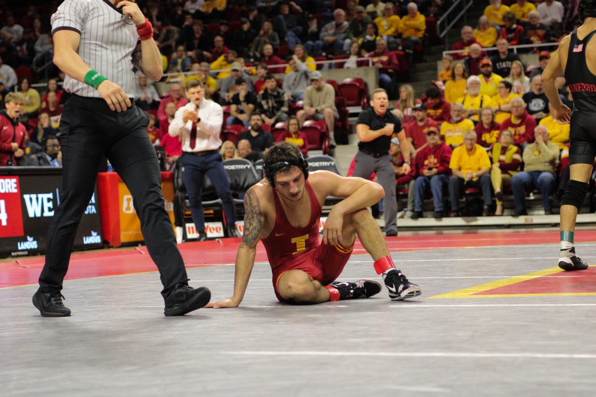 Zach Redding with head down after a pinned loss to his opponent at during Iowa State vs. Stanford University wrestling match at Hilton Coliseum, Ames, Iowa, Nov. 8, 2024.