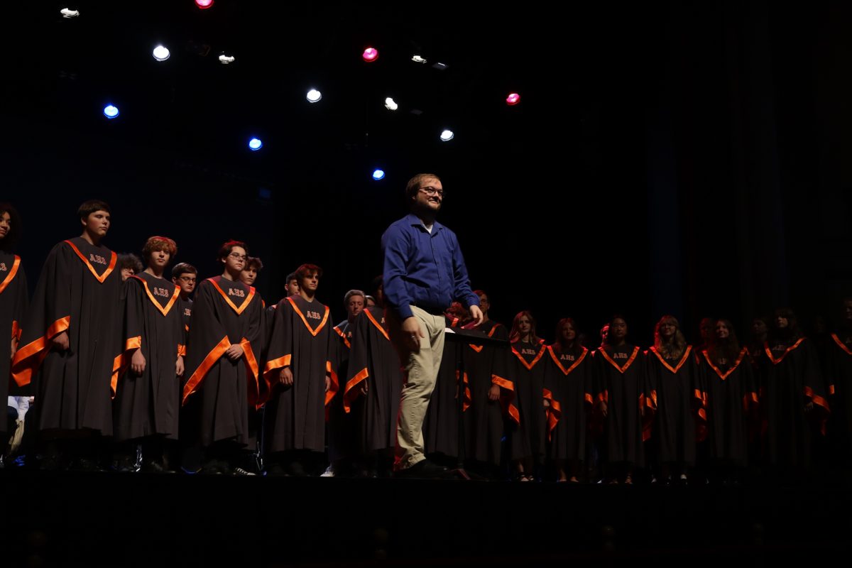 Ames High School Concert Chorale conducted by Joe Strong sing The Battle Hymn of the Republic.