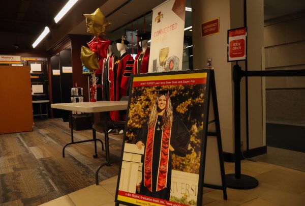 A reminder for winter graduates to get their cap and gown in the ISU book store, taken on November 11, 2024 in Ames, Iowa