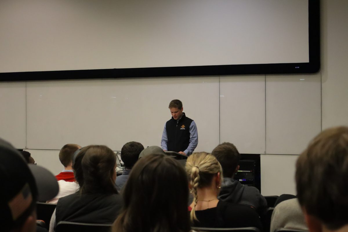 Jack Campbell, president of the Agriculture Business club, gives opening remarks to the attendees present, taken on November 11, 2024 in Ames, IA