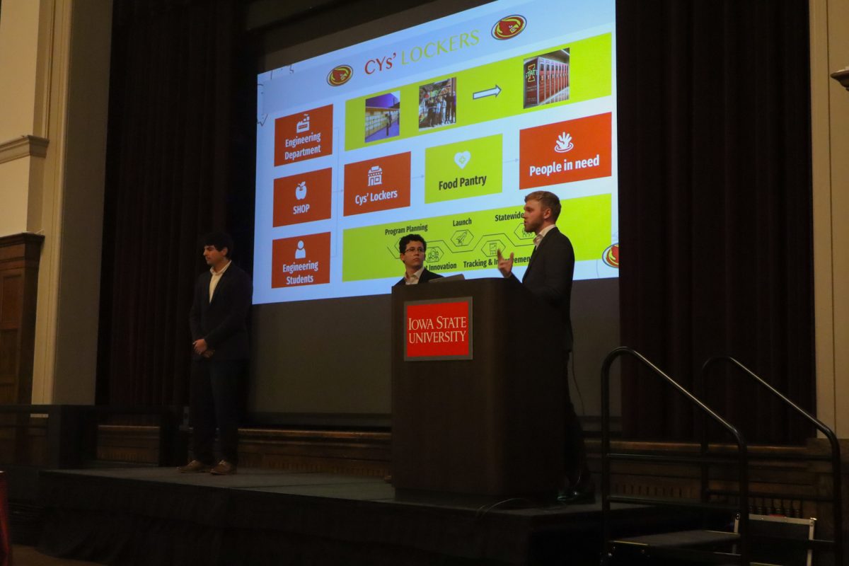 Miguel Bojoquez, Andrew Holtz, and Antonio Reyes-Muñoz mid-presentation for the Food Insecurity Challenge Pitchoff, taken on November 19, 2024 in the Memorial Union, Ames, IA.