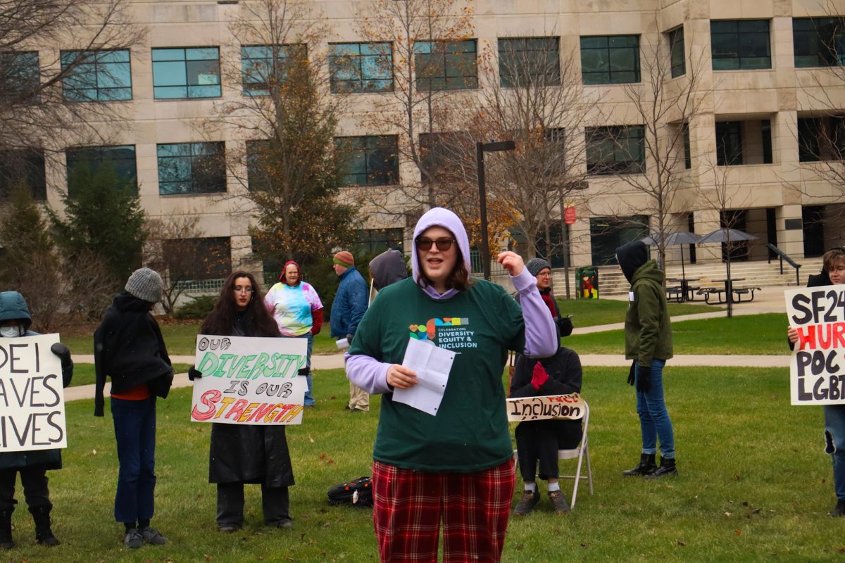 Jackie Snook leads a speech about the positive impact DEI has had on them throughout their college career, taken on November 11, 2024 outside Park Library, Ames, IA