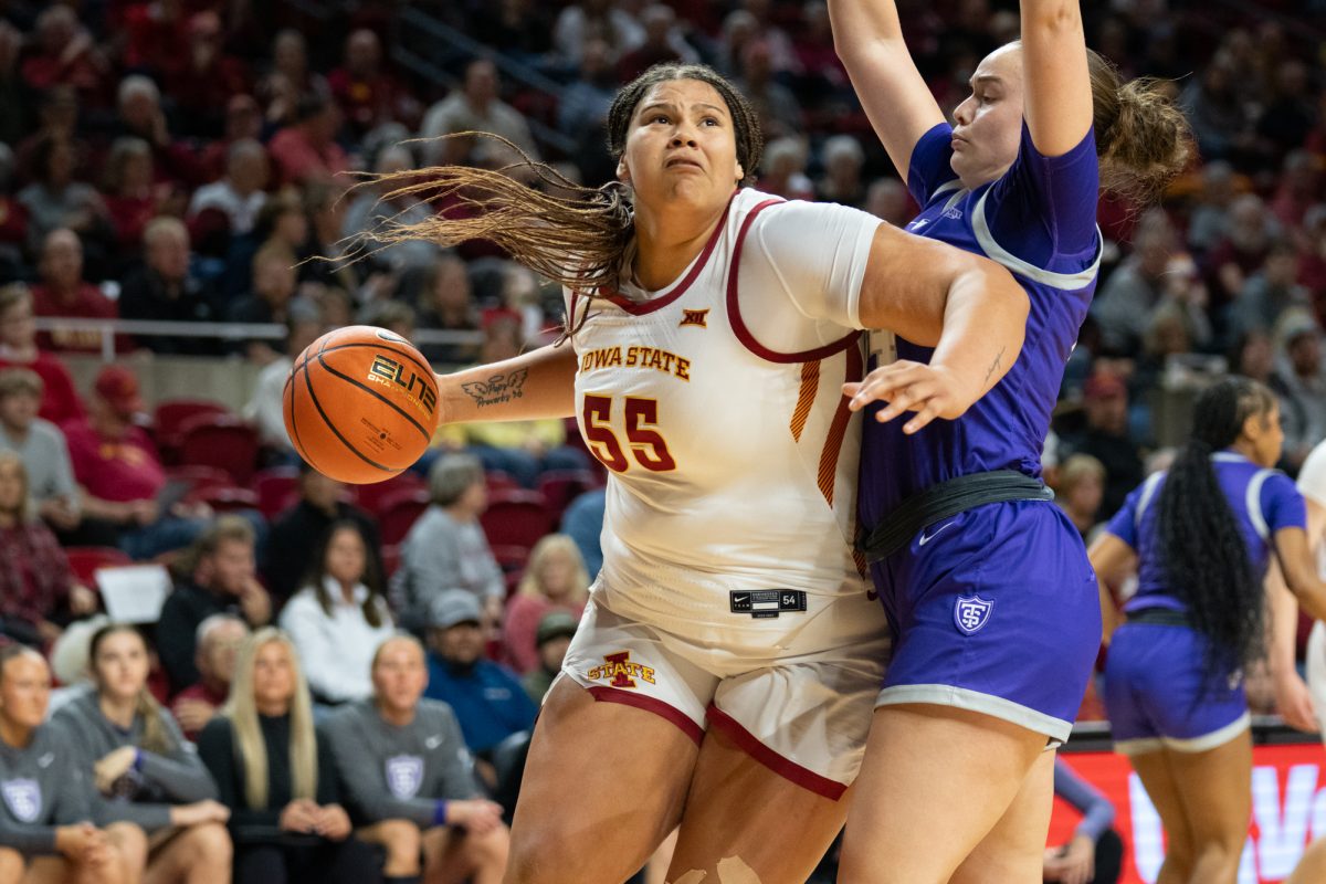 Audi Crooks looks to shoot the ball while being guarded by Jo Langbehn (34) during the game vs. University of St. Thomas, Hilton Coliseum, Ames, Iowa, Nov. 14, 2024.