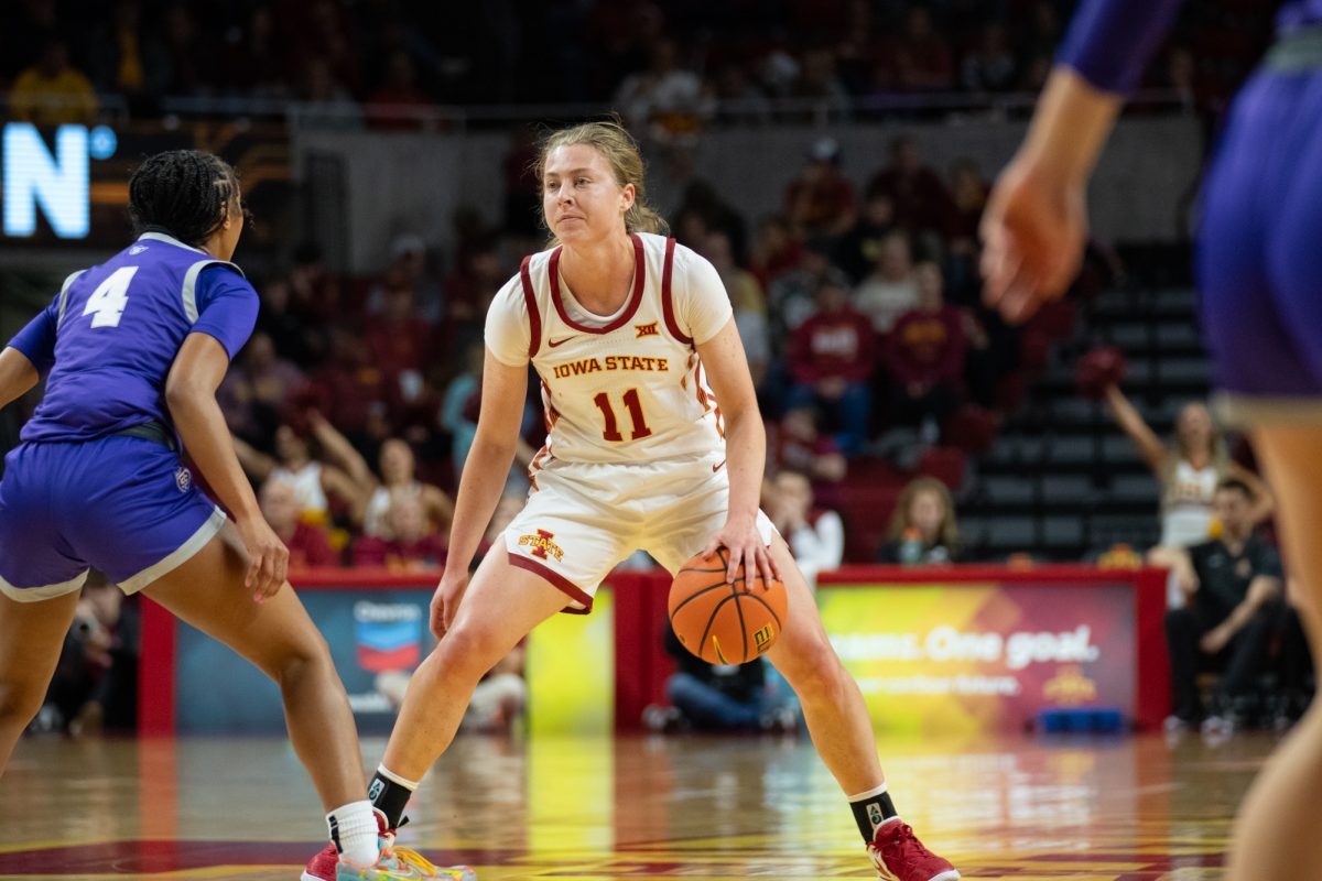 Emily Ryan dribbles the ball while being guarded by Jade Hill (4) during the game vs. University of St. Thomas, Hilton Coliseum, Ames, Iowa, Nov. 14, 2024.