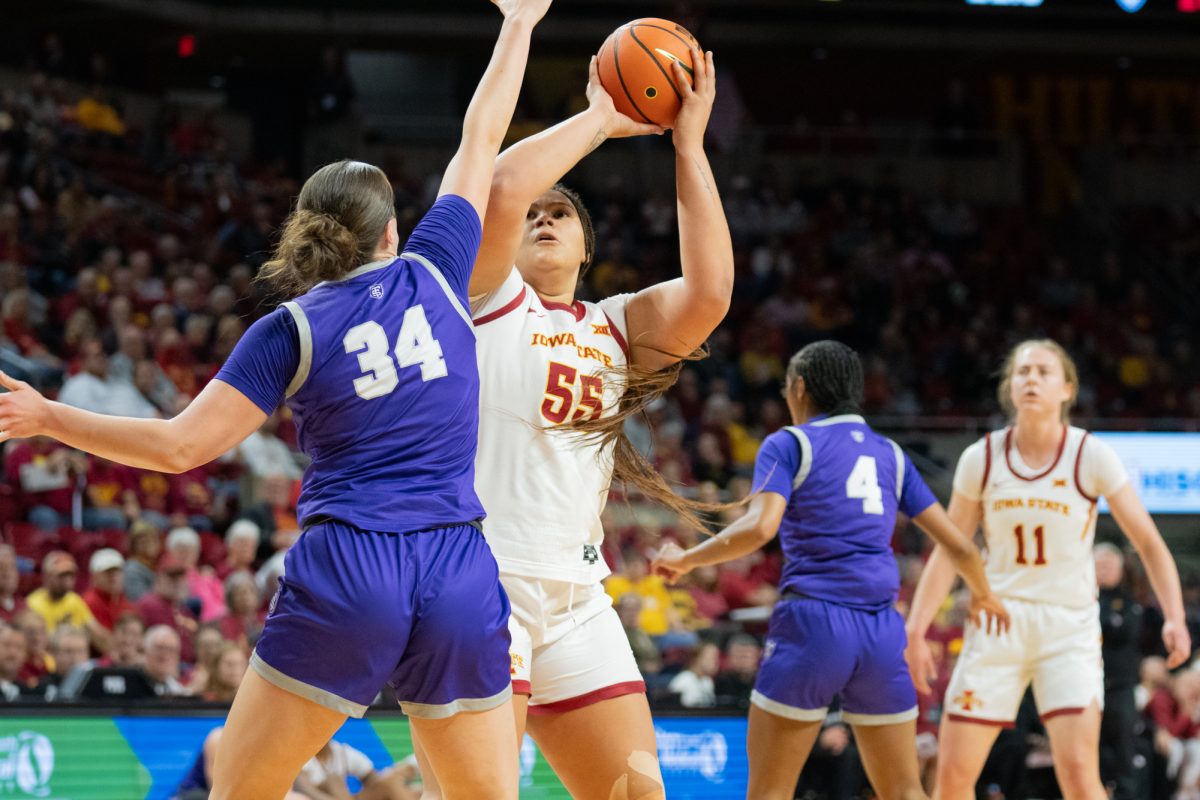 Audi Crooks (55) looks to shoot the ball over Jo Langbehn (34) during the game vs. University of St. Thomas, Hilton Coliseum, Ames, Iowa, Nov. 14, 2024. 