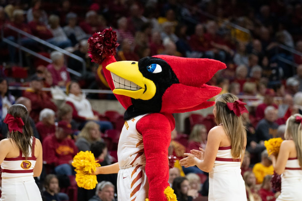 Cy cheers with the cheerleading team during the women's basketball game vs. University of St. Thomas, Hilton Coliseum, Ames, Iowa, Nov. 14, 2024. 