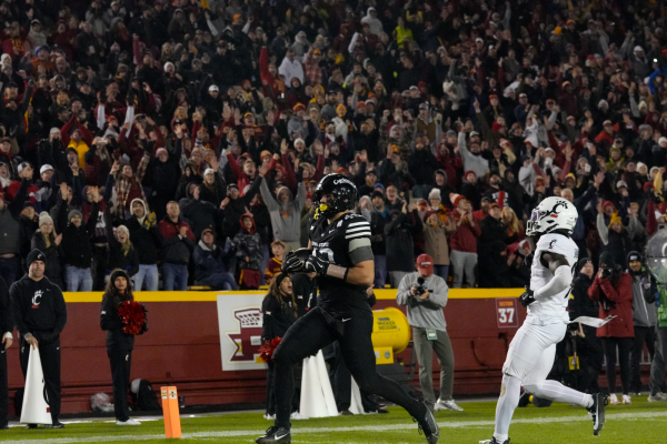 Stevo Klotz(49) runs in for a touchdown against Cincinnati in Jack Trice Stadium, Nov. 16, 2024.