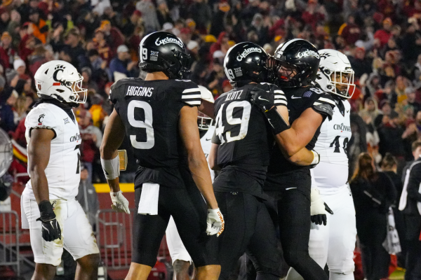 Stevo Kotz (49) celebrates a touchdown with teammates in Jack Trice Stadium, Nov. 16, 2024.