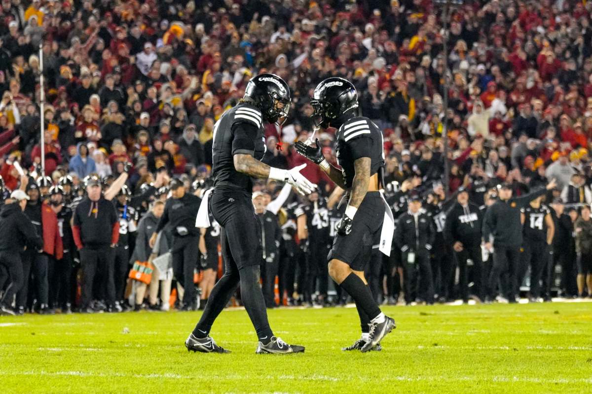 Malik Verdon (7) and Jeremiah Cooper (4) celebrate a fumble recovery, Jack Trice Stadium, Nov. 16, 2024.