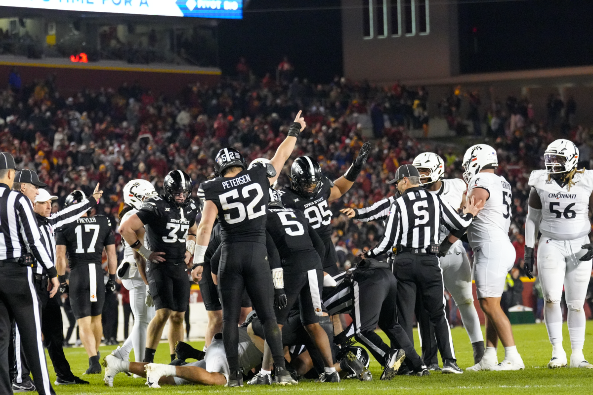 Joey Petersen (52) indicates a fumble recovery against Cincinnati, Jack Trice Stadium, Nov. 16, 2024.