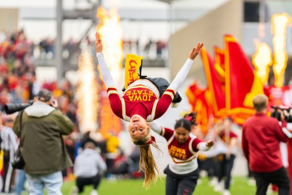 Cyclone cheerleaders do stunts before the Iowa State vs. Texas Tech University football game at Jack Trice Stadium on Nov. 2, 2024.