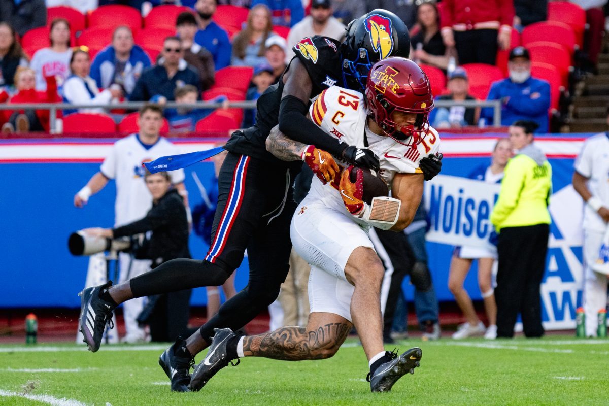 Iowa State WR Jaylin Noel (13) gets tackeled by Cobee Bryant (2) of the University of Kansas, 
GEHA Field at Arrowhead Stadium, Nov. 9, 2024.