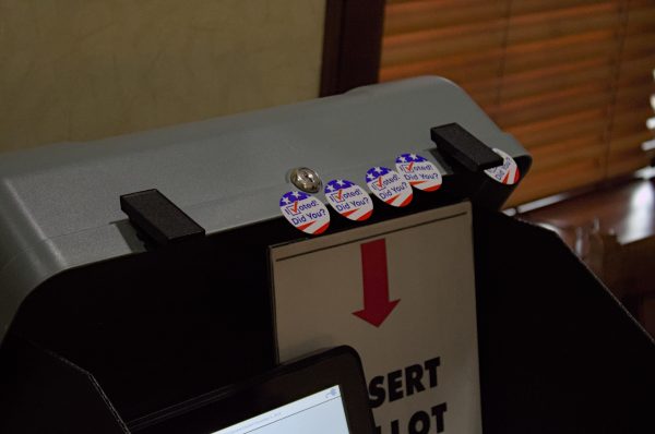 Voting stickers on the ballot scanning machine in the Ames 21 precinct located in the Frederiksen Court Community Center on Hawthorn Ct. Dr., Ames, IA, Nov. 5, 2024.