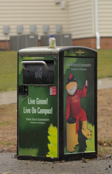 Solar-powered trash compactor in front of an apartment building at the Frederiksen Court Apartments, Ames, Iowa, Nov. 18, 2024. 