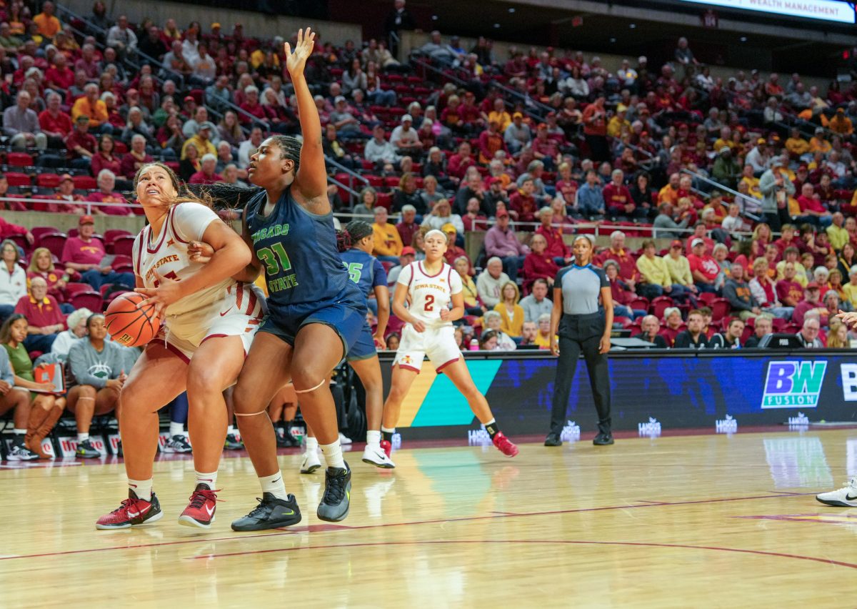 Iowa State Audi Crooks (55) fights off a Chicago State player while trying for a shot at the net during the Cyclones' home opener, Hilton Coliseum, Nov. 4, 2024.