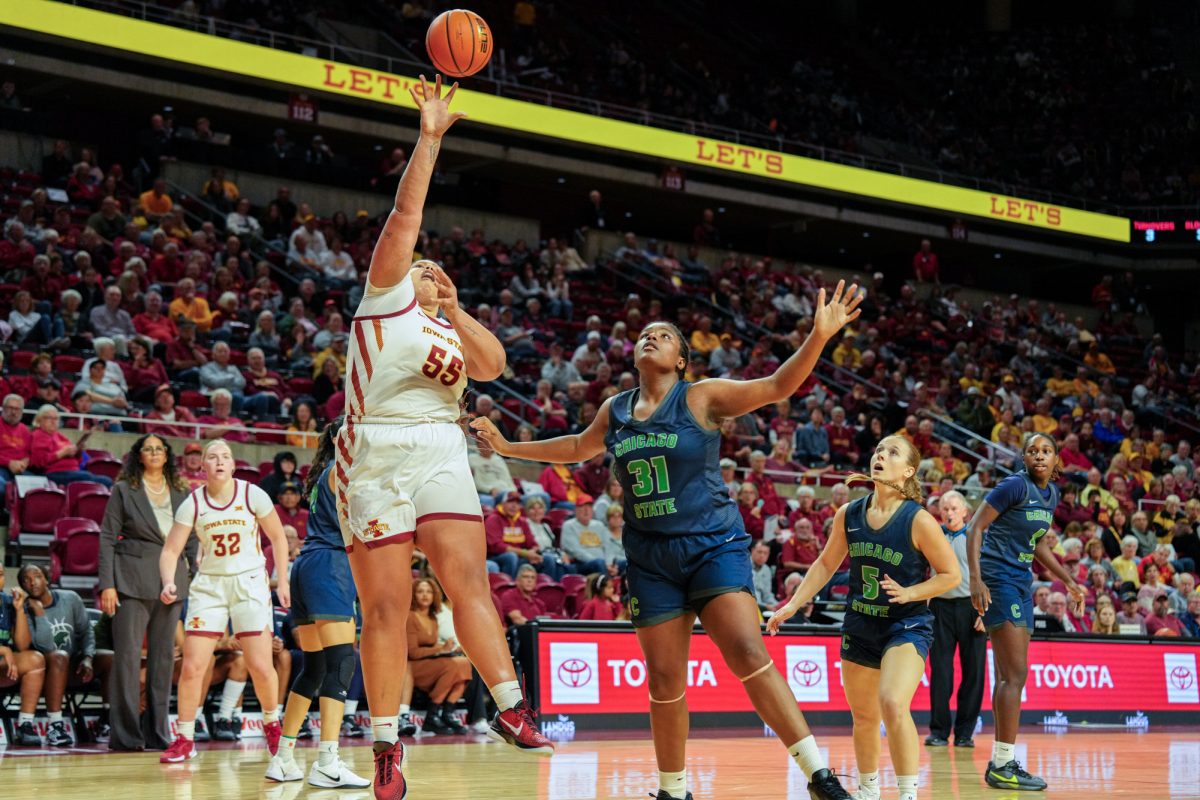 Iowa State Audi Crooks (55) tries to shoot around a defending Chicago State player, one of her ten two-point shots during the home opener game, Hilton Coliseum, Nov. 4, 2024.