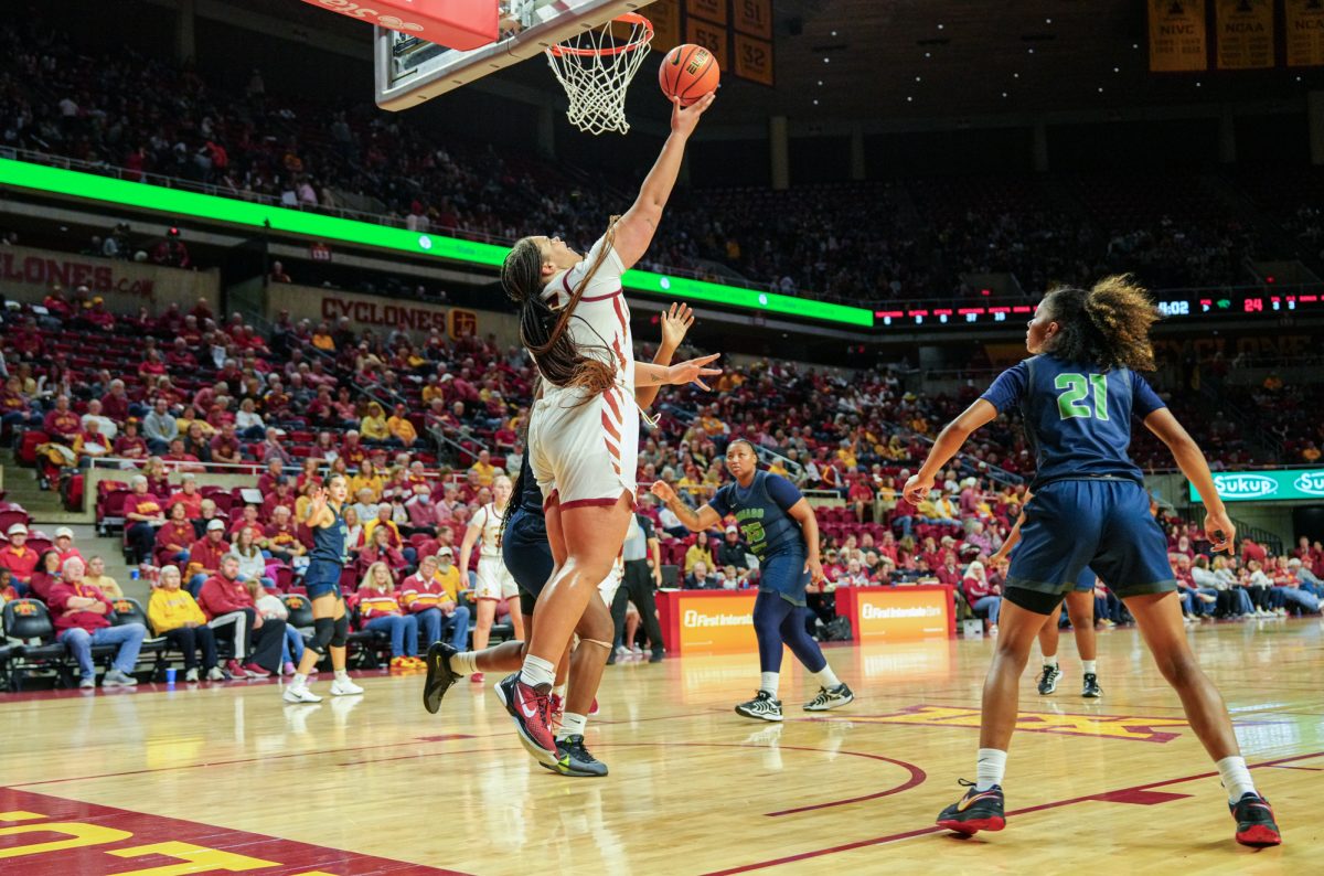 Iowa State Audi Crooks (55) shoots from under the net with three defending Chicago State players looking for the rebound, Hilton Coliseum, Nov. 4, 2024.