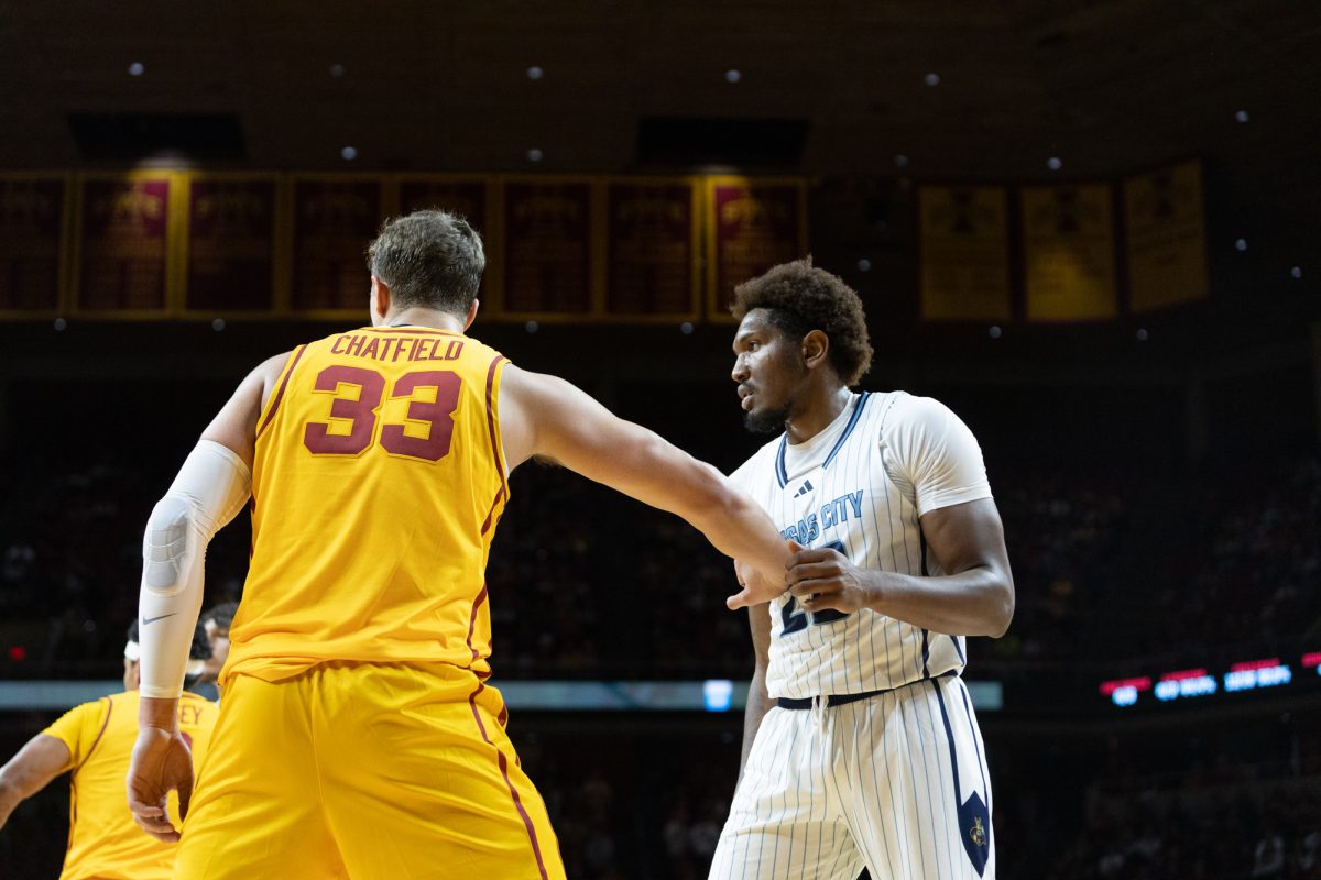 Brandton Chatfield (33) plays defense against Melvyn Ebonkoli (20) during of the Iowa State Cyclones vs. the Kansas City Roos game at Hilton Coliseum in Ames, Iowa on Nov. 11, 2024.