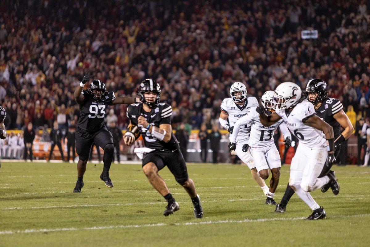 Rocco Becht (3) runs with the ball after breaking away from the defensive line of the Bearcats during the Iowa State Cyclones and Cincinnati Bearcats game in Ames Iowa on Nov. 16, 2024.